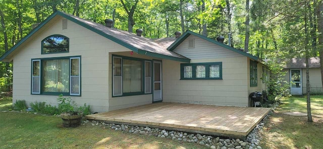 14786 Nuenfelt Rd, Johannesburg, MI 49756 - back of house featuring a deck and a yard