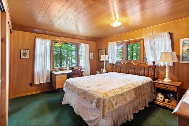 14786 Nuenfelt Rd, Johannesburg, MI 49756 - bedroom featuring dark colored carpet, wood walls, and wooden ceiling
