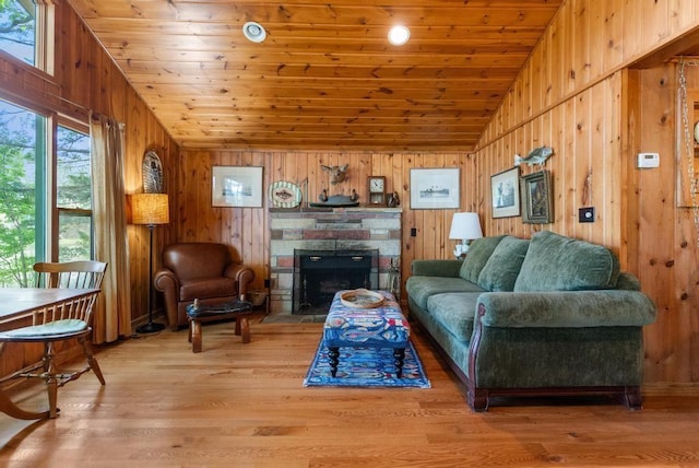 14786 Nuenfelt Rd, Johannesburg, MI 49756 - living area with plenty of natural light, wooden walls, wood ceiling, vaulted ceiling, and light wood-style flooring