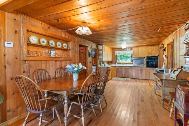 14786 Nuenfelt Rd, Johannesburg, MI 49756 - dining space with wood walls, wood ceiling, and light wood-type flooring