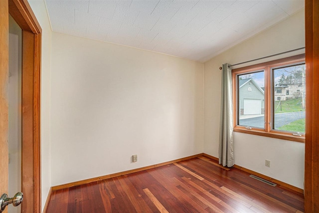 3414 Reycraft Rd, Boyne City, MI 49712 - empty room featuring dark wood finished floors and baseboards