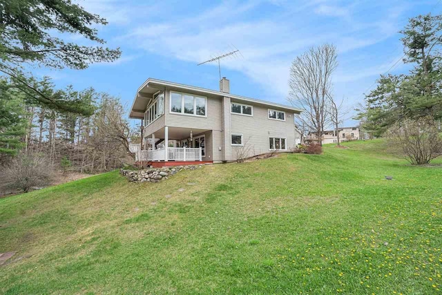 3414 Reycraft Rd, Boyne City, MI 49712 - rear view of house with a chimney and a yard