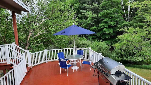 3414 Reycraft Rd, Boyne City, MI 49712 - wooden deck featuring grilling area and outdoor dining area