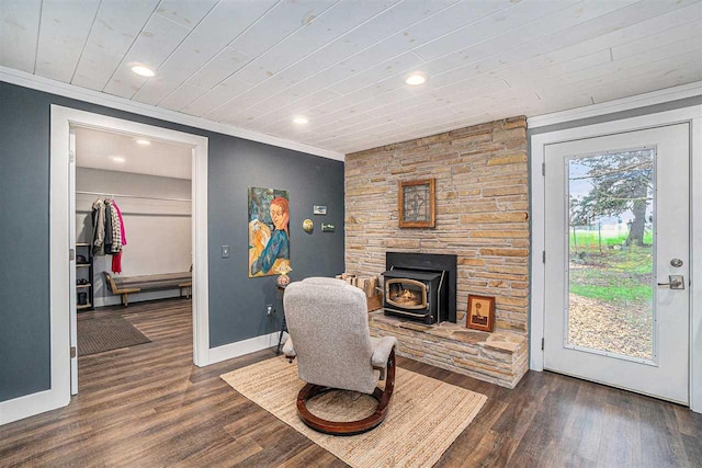 110 Hillcrest, East Jordan, MI 49727 - sitting room with a wood stove, crown molding, baseboards, wood finished floors, and recessed lighting