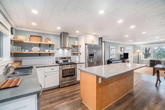 110 Hillcrest, East Jordan, MI 49727 - kitchen with appliances with stainless steel finishes, wall chimney range hood, open shelves, a sink, and recessed lighting