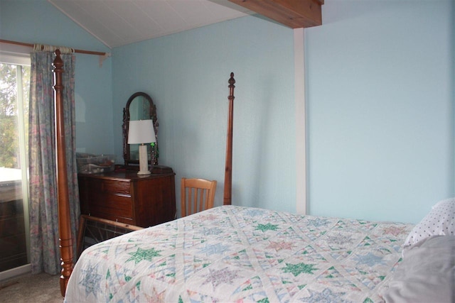 bedroom with vaulted ceiling and carpet floors