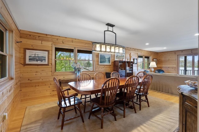 8120 Susan Shore Dr, Charlevoix, MI 49720 - dining space with wood walls, recessed lighting, and light wood-style floors