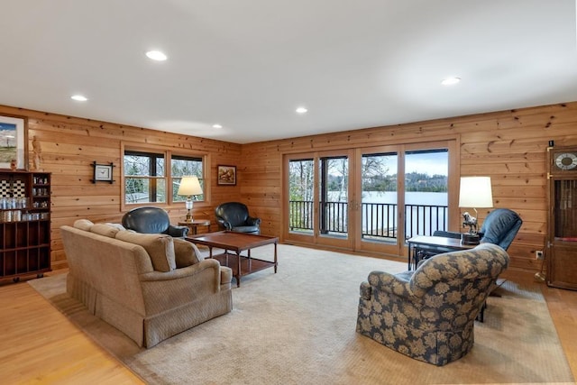 8120 Susan Shore Dr, Charlevoix, MI 49720 - living room with plenty of natural light, recessed lighting, wooden walls, and light wood-type flooring