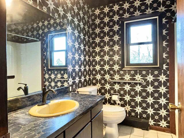 bathroom with tile patterned floors, toilet, and vanity