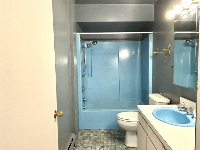 full bathroom featuring toilet, a baseboard heating unit, vanity, and washtub / shower combination