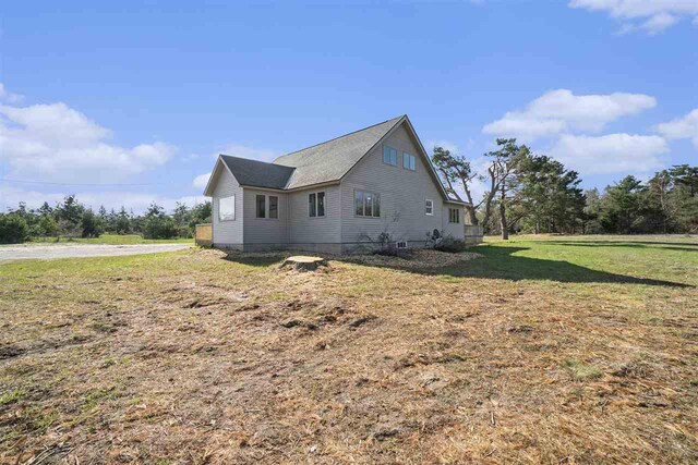 view of property exterior featuring a yard