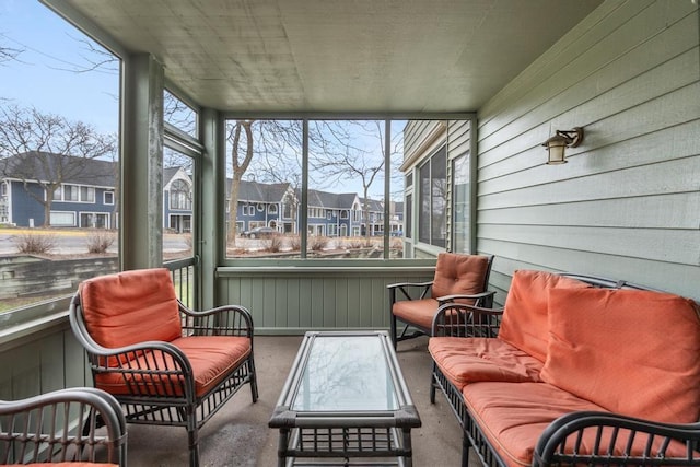sunroom / solarium with a residential view