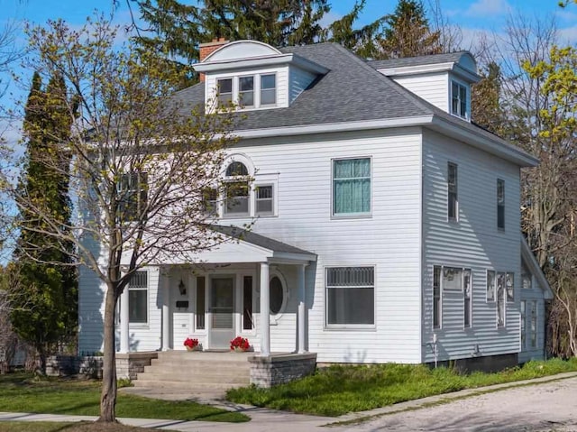 619 Kalamazoo Ave, Petoskey, MI 49770 - view of front facade featuring a porch, roof with shingles, and a chimney