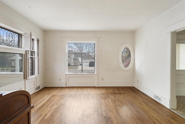 619 Kalamazoo Ave, Petoskey, MI 49770 - unfurnished dining area with hardwood / wood-style flooring