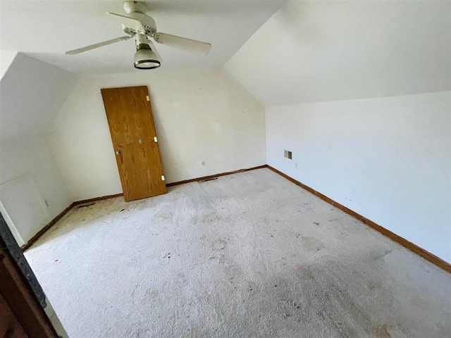 204 E Forest Home Ave, Bellaire, MI 49615 - additional living space with vaulted ceiling, ceiling fan, baseboards, and carpet flooring