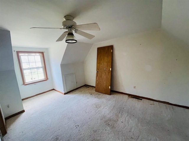 204 E Forest Home Ave, Bellaire, MI 49615 - additional living space featuring carpet floors, vaulted ceiling, baseboards, and a ceiling fan