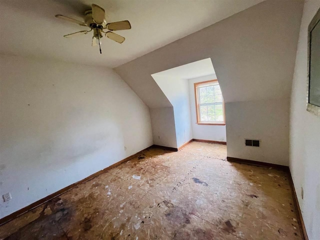 204 E Forest Home Ave, Bellaire, MI 49615 - bonus room featuring vaulted ceiling, ceiling fan, and baseboards