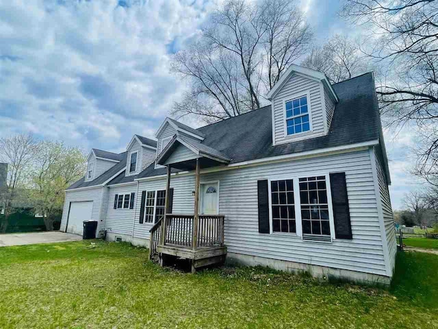 204 E Forest Home Ave, Bellaire, MI 49615 - cape cod house with a garage and a front yard