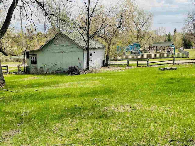 204 E Forest Home Ave, Bellaire, MI 49615 - view of yard featuring a playground