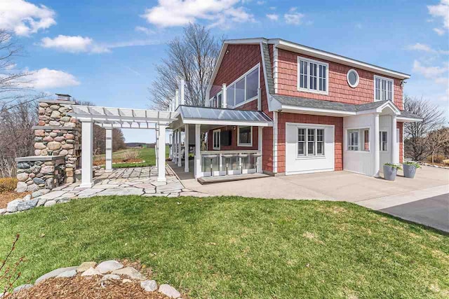 4133 Shadynook Rd, Central Lake, MI 49622 - rear view of property with a patio, a pergola, and a yard