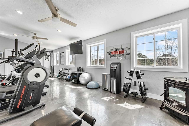 4133 Shadynook Rd, Central Lake, MI 49622 - exercise room with a textured ceiling, a ceiling fan, recessed lighting, and baseboards