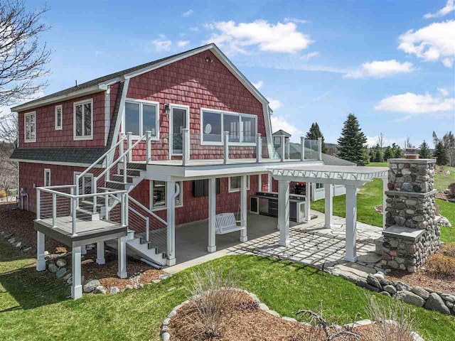 4133 Shadynook Rd, Central Lake, MI 49622 - back of property featuring a patio, stairway, a pergola, and a yard