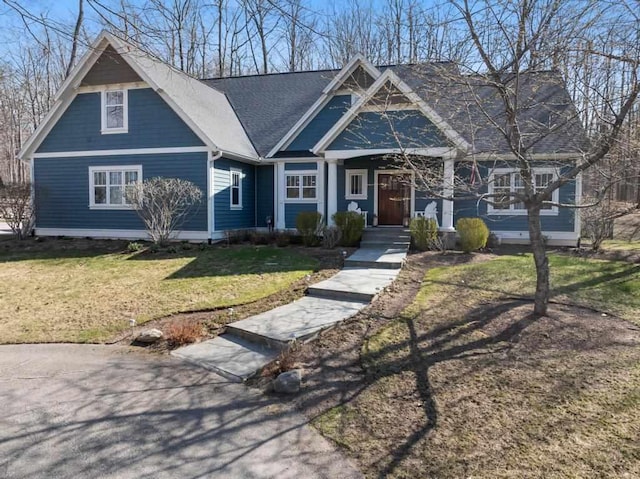 334 Birchwood Ter, Harbor Springs, MI 49740 - view of front of house with a front yard