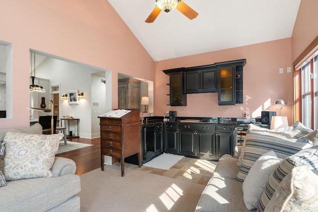 334 Birchwood Ter, Harbor Springs, MI 49740 - living room with a ceiling fan, high vaulted ceiling, and light wood-type flooring