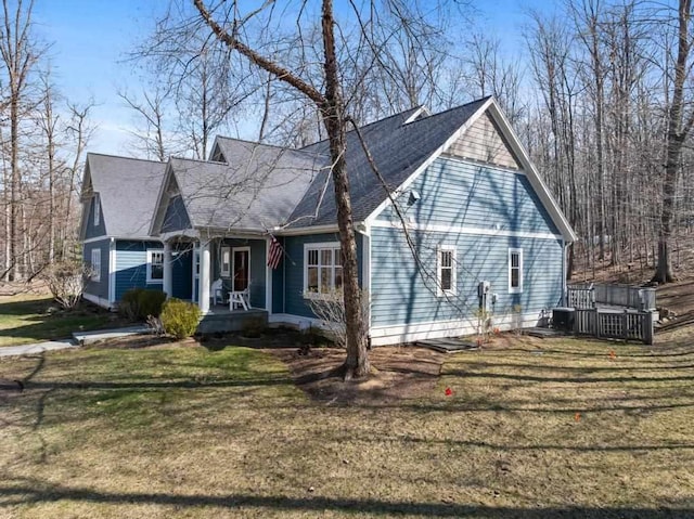 334 Birchwood Ter, Harbor Springs, MI 49740 - view of front of house featuring a porch and a front yard