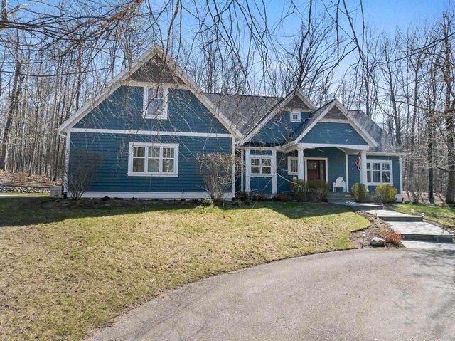 334 Birchwood Ter, Harbor Springs, MI 49740 - view of front of home with a front yard and a porch