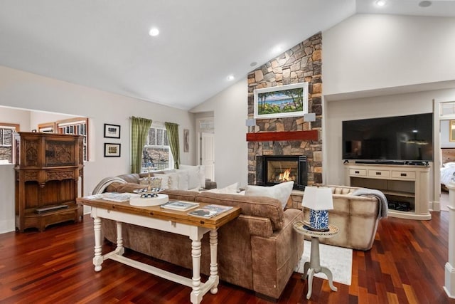 334 Birchwood Ter, Harbor Springs, MI 49740 - living area with lofted ceiling, dark wood-type flooring, a fireplace, and recessed lighting