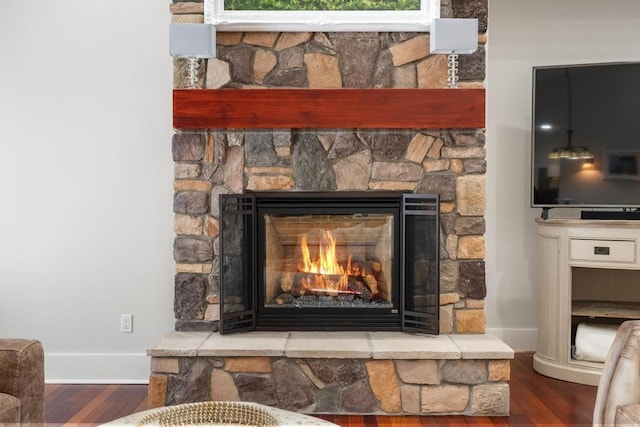 334 Birchwood Ter, Harbor Springs, MI 49740 - detailed view of wood finished floors, baseboards, and a stone fireplace