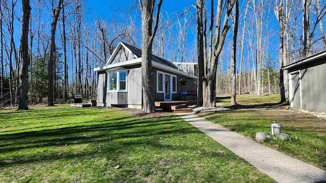 view of property exterior featuring a lawn