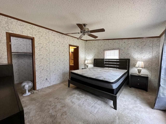 4049 Musser Rd, Mancelona, MI 49659 - bedroom featuring crown molding, carpet, a textured ceiling, a closet, and ceiling fan