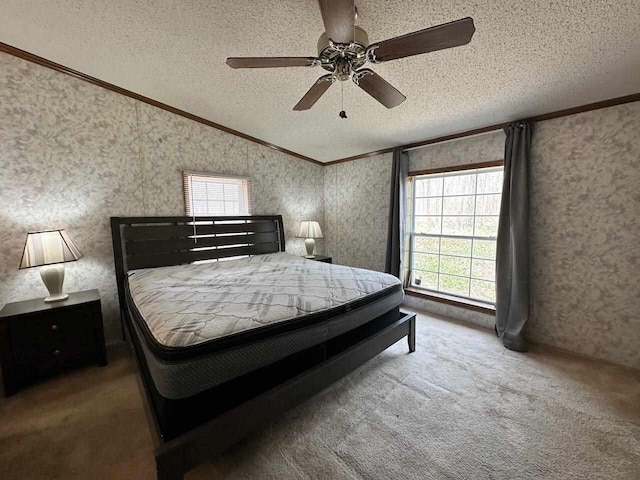 4049 Musser Rd, Mancelona, MI 49659 - bedroom featuring crown molding, a textured ceiling, carpet flooring, wallpapered walls, and ceiling fan
