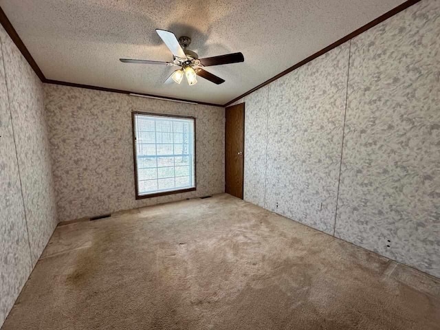 4049 Musser Rd, Mancelona, MI 49659 - unfurnished room featuring crown molding, carpet flooring, a textured ceiling, and ceiling fan