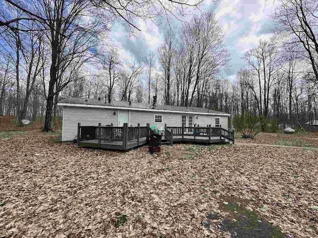 4049 Musser Rd, Mancelona, MI 49659 - back of house with a wooden deck