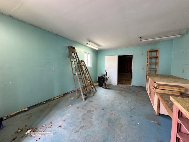 4049 Musser Rd, Mancelona, MI 49659 - miscellaneous room with unfinished concrete floors