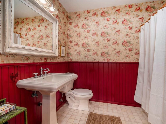 101 S Addis Rd, Boyne City, MI 49712 - bathroom featuring wainscoting, toilet, and tile patterned flooring