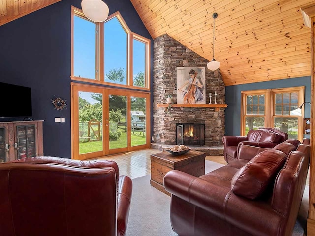101 S Addis Rd, Boyne City, MI 49712 - living room with wood ceiling, a fireplace, and high vaulted ceiling