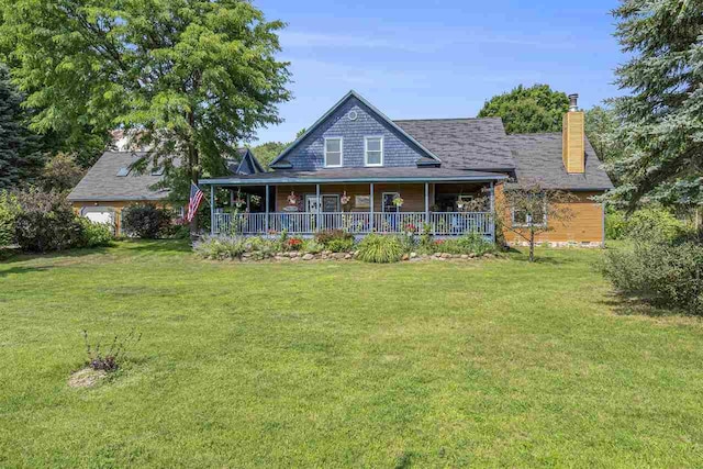 101 S Addis Rd, Boyne City, MI 49712 - back of house with covered porch, a yard, and a chimney