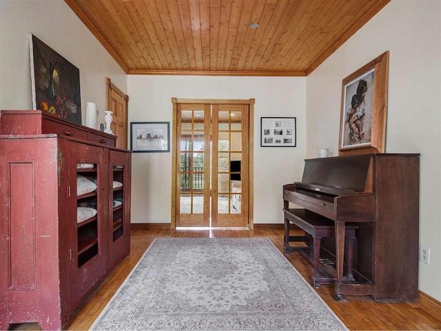 101 S Addis Rd, Boyne City, MI 49712 - sitting room with crown molding, wood ceiling, french doors, wood finished floors, and baseboards