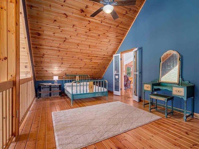 101 S Addis Rd, Boyne City, MI 49712 - bedroom featuring vaulted ceiling, hardwood / wood-style floors, baseboards, and wood ceiling