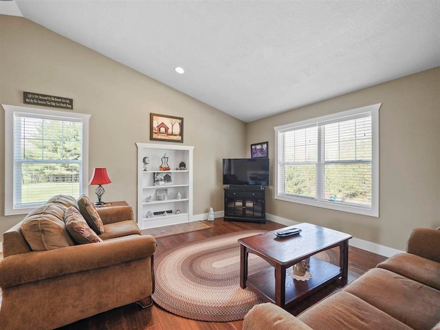 10300 Vista Ridge Dr, Alden, MI 49612 - living room featuring vaulted ceiling, wood finished floors, baseboards, and recessed lighting