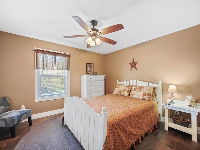 10300 Vista Ridge Dr, Alden, MI 49612 - bedroom with baseboards, dark wood finished floors, and ceiling fan