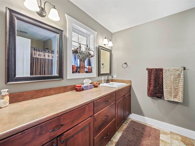 10300 Vista Ridge Dr, Alden, MI 49612 - full bathroom with baseboards and vanity