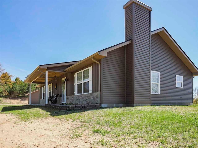 10300 Vista Ridge Dr, Alden, MI 49612 - view of side of property featuring a chimney