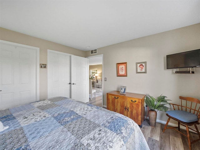 1564 Emerald Ct Unit 85, Petoskey, MI 49770 - bedroom featuring wood finished floors and baseboards