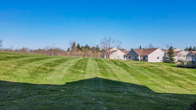 1564 Emerald Ct Unit 85, Petoskey, MI 49770 - view of grassy yard featuring a residential view
