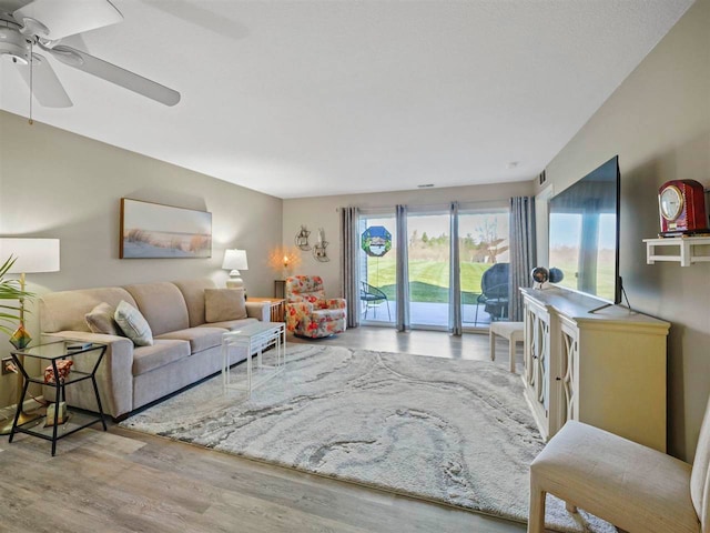 1564 Emerald Ct Unit 85, Petoskey, MI 49770 - living room with wood finished floors and ceiling fan